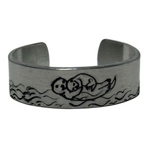 Handmade stamped silver adjustable hypoallergenic ring with Otter & baby Design